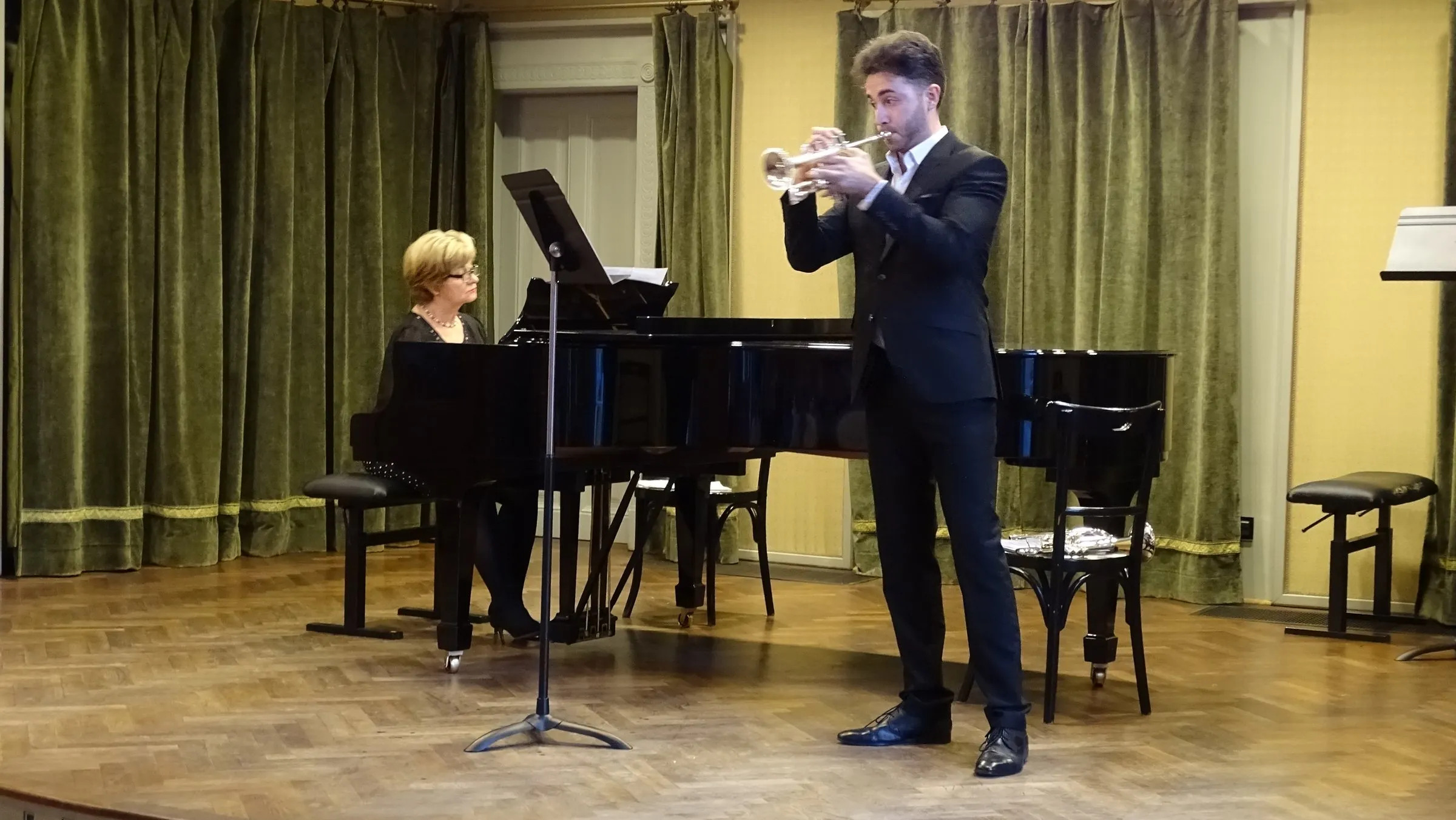 A young trumpeter performs with a pianist at the Liszt Academy, Budapest