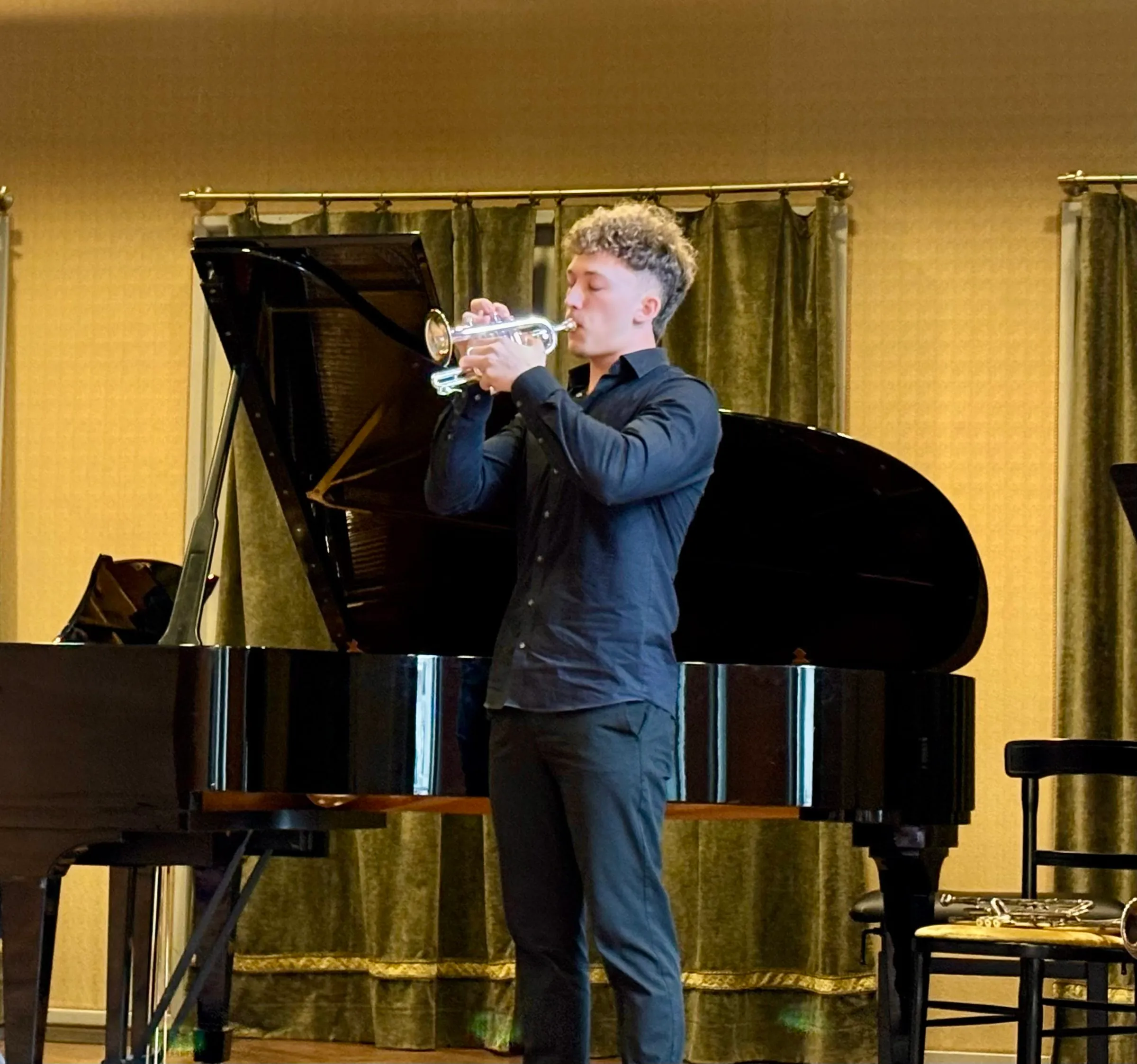 A trumpeter performs with a pianist at the Liszt Academy